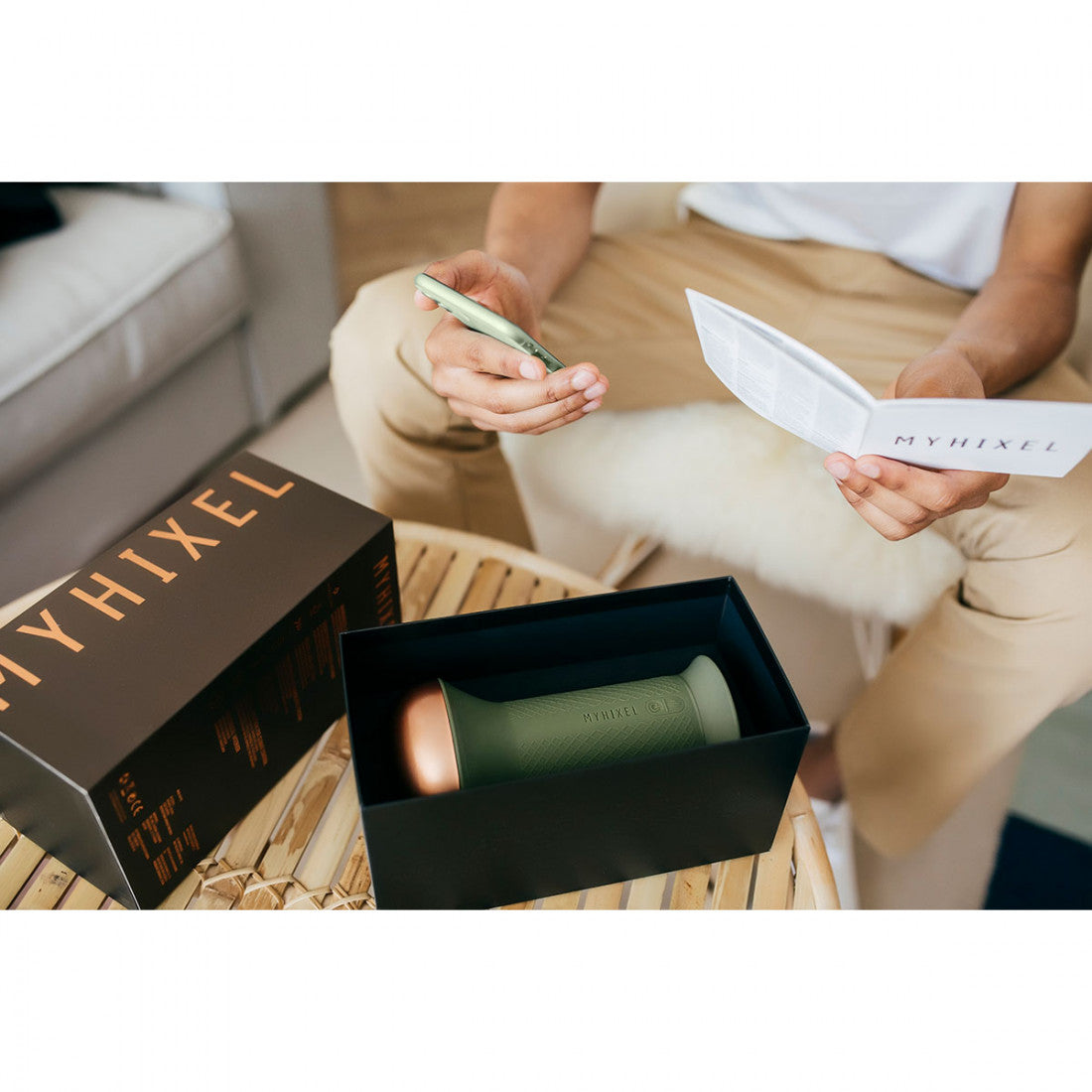 person reading MYHIXEL TR information and MYHIXEL TR on a table table