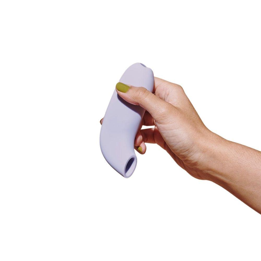 Aer by Dame being held in hand