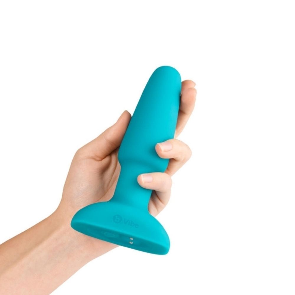 Teal B-Vibe Rimming Plug 2 being held in hand
