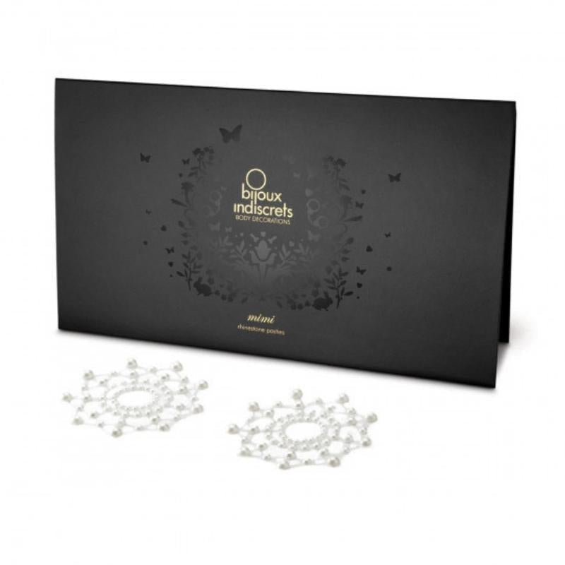 Pearl Bijoux Indiscrets Mimi Circles in front of the packaging they come in 
