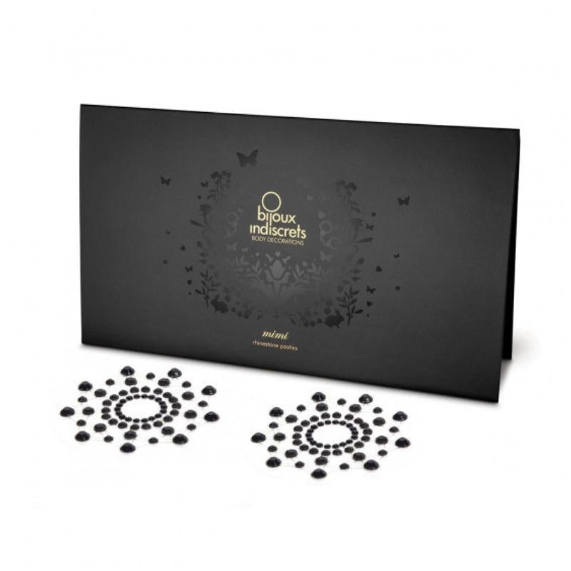 Black Bijoux Indiscrets Mimi Circles in front of the packaging they come in