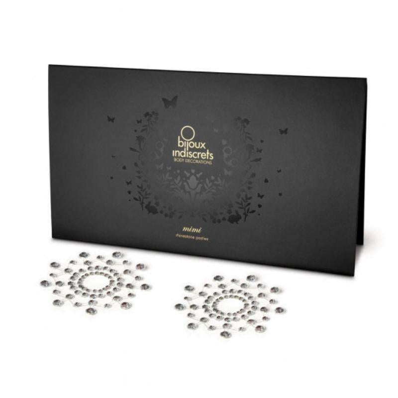 Crystal clear Bijoux Indiscrets Mimi Circles in front of the packaging they come in