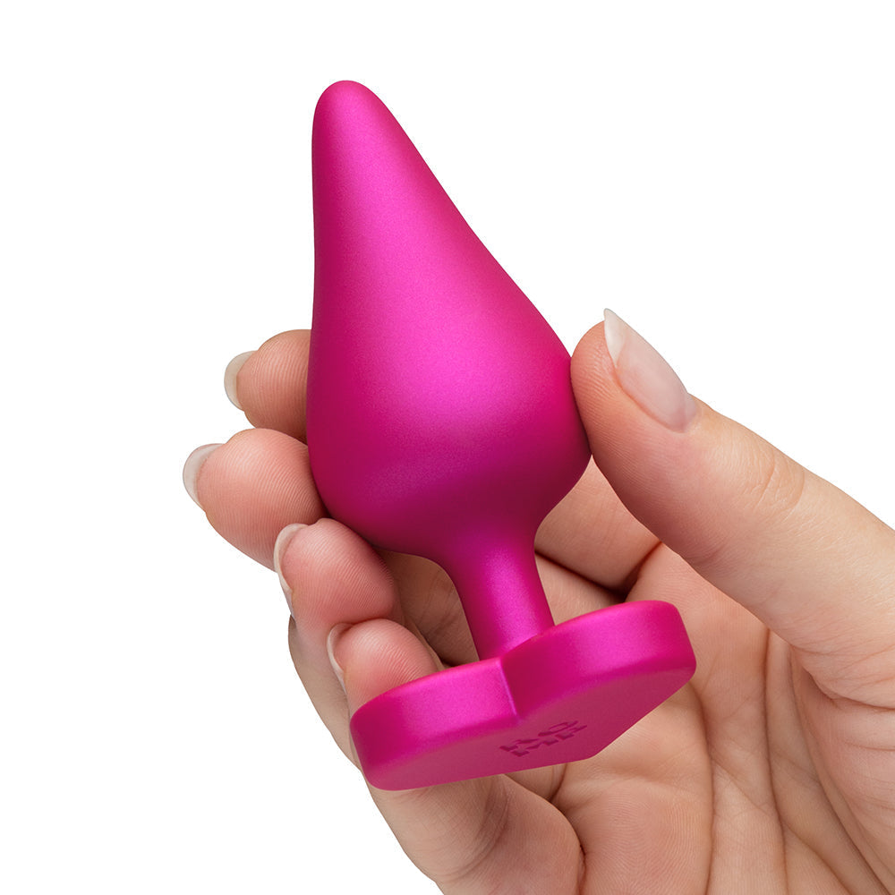 Hand holding ROMP Luster Anal Plug