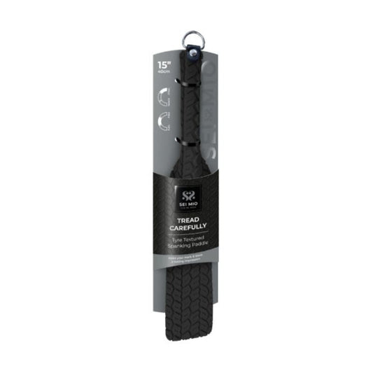 Black Sei Mio Tyre Paddle in its packaging showing its textured side