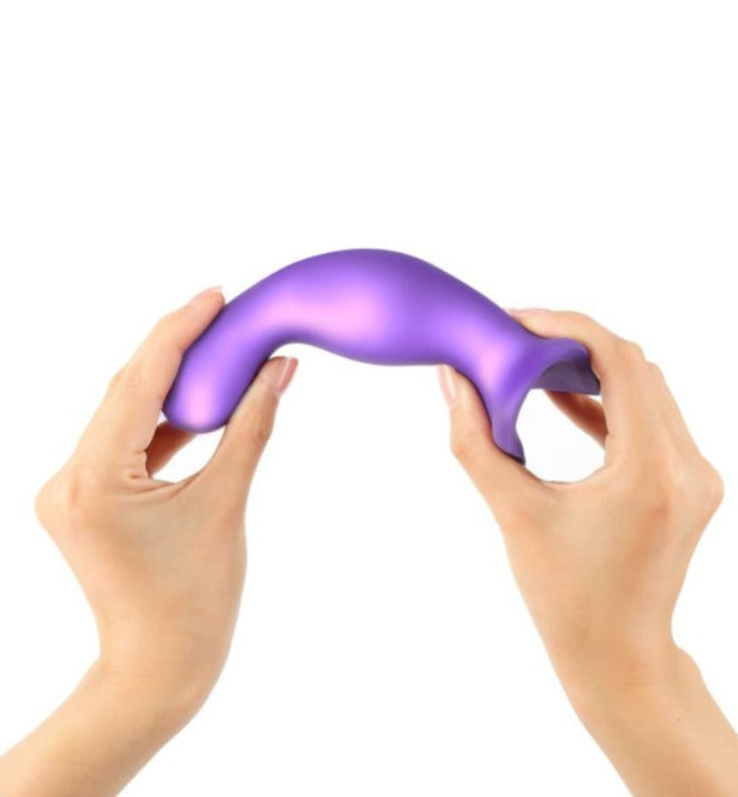 Strap-On-Me Curvy held in hands while being bent